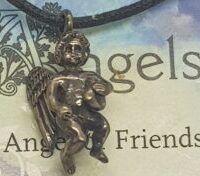 silver angel of friendship on thong close up