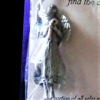pewter angel pendant holding pink ribbon entitled Faith supporting breast cancer awareness close up