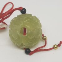 jade ball on red cord