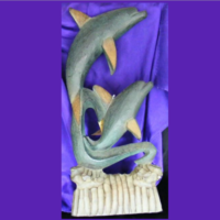 large wooden dolphin twin sculpture