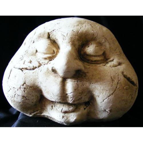 stone man garden ornament with close eyes