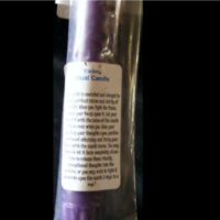purple empowered candle for visions ritual close up