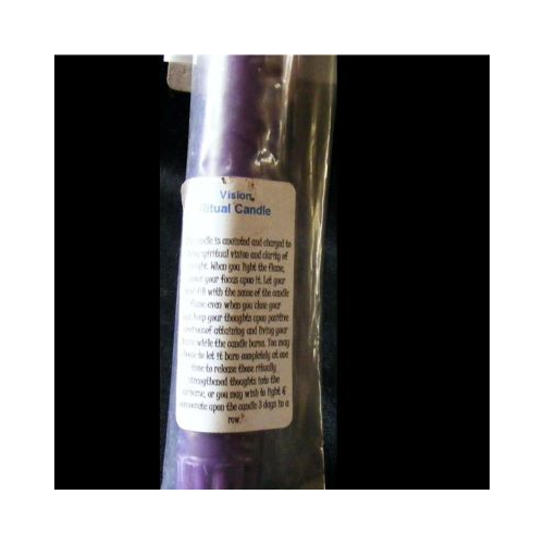 purple empowered candle for visions ritual close up