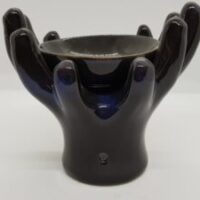 black cupped hands oil burner reverse side