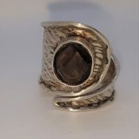 wide to narrow textured silver band with faceted smoky quartz