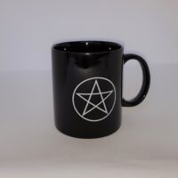 black mug with white pentagram design
