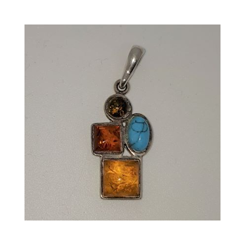 silver pendant set with 3 different coloured ambers and turquoise