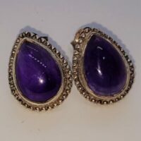teardrop shaped amethyst stud earrings in fancy silver setting