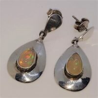 teardrop shaped ethopian opals in wide silver setting earrings