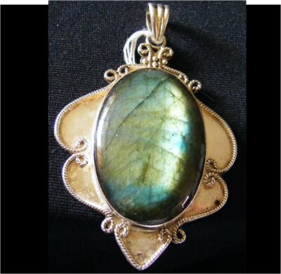 large silver pendant with large oval labradorite stone