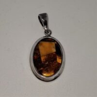 mixed amber in silver pendant