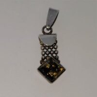 small square green amber pendant with silver ball decoration and loop