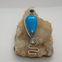 turquoise and blue topaz in silver pendant