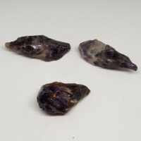 three small pieces of auralite 23