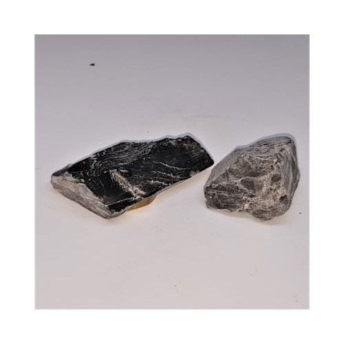 two pieces of rough black moonstone