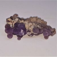 small piece of grape agate side view