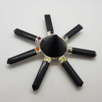 black tourmaline generator with cone in the centre and different small stones on each of 7 points