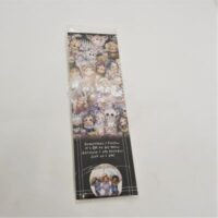 laminated bookmark with images of faces words loved as I am