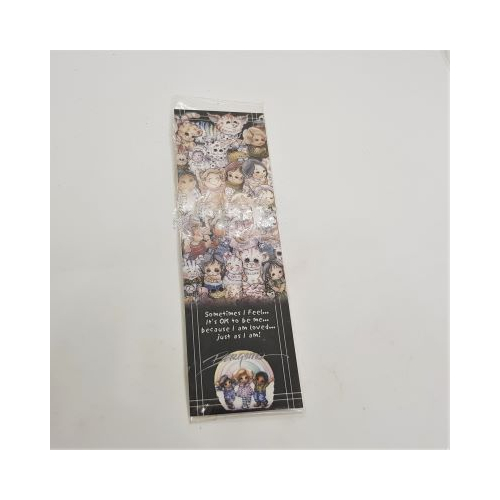 laminated bookmark with images of faces words loved as I am