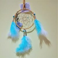native american made dreamcatcher with turquoise and white feathers