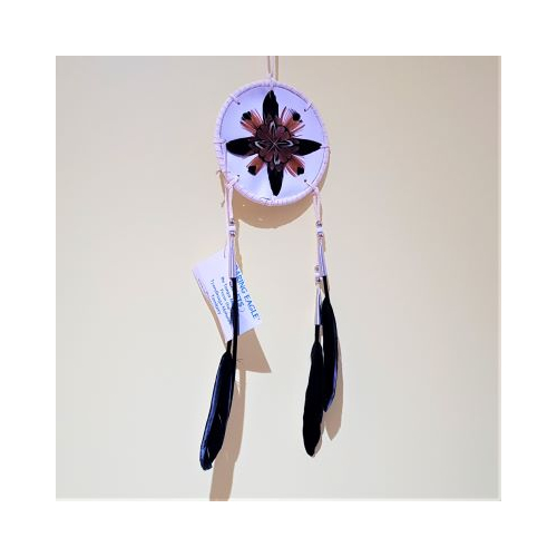 native american made white shield with feather decoration