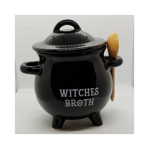 black cauldron shaped soup bowl with lid and ceramic spoon words in white witches broth
