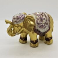 gold elephant incense holder with silver coloured decoration and jewel