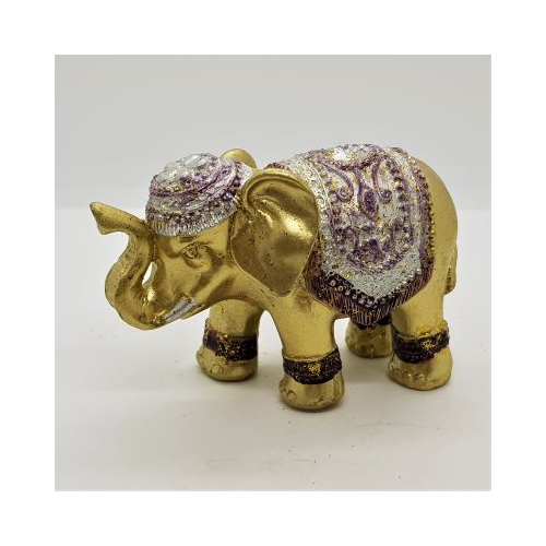 gold elephant incense holder with silver coloured decoration and jewel