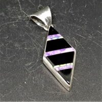 native american made silver diamond shaped pendant set with black onyx charoite and opal