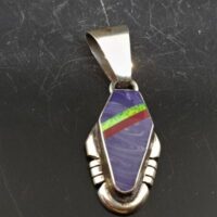 native american made silver fancy design pendant with heavy bail and inset with charoite coral and opal