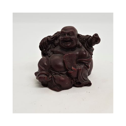 small red laughing buddha