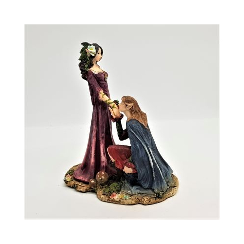 resin elf couple with girl standing and boy kneeling kissing her hand