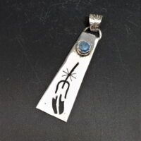 native american made long silver pendant with cut out feather design