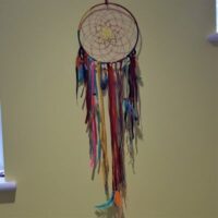multi coloured dreamcatcher with hanging ribbons