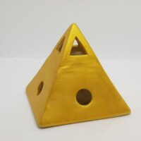 gold coloured pyramid shaped oil burner