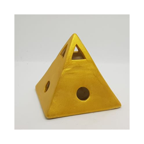 gold coloured pyramid shaped oil burner