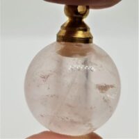 small spherical quartz perfume bottle with loop for chain