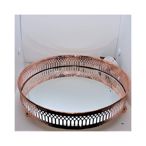 rose gold coloured edging on large mirrored candle stand