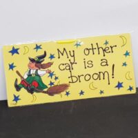 small sign witch on broom words my other car is a broom