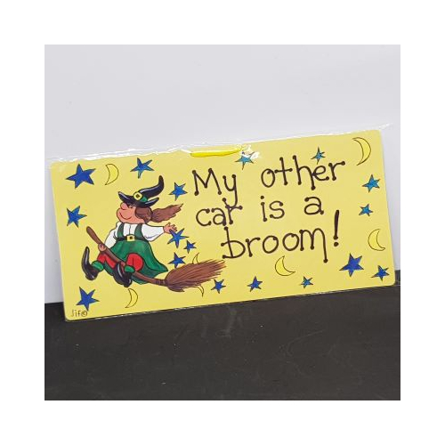 small sign witch on broom words my other car is a broom