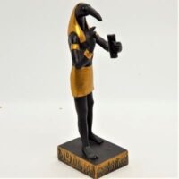 black and gold thoth figure