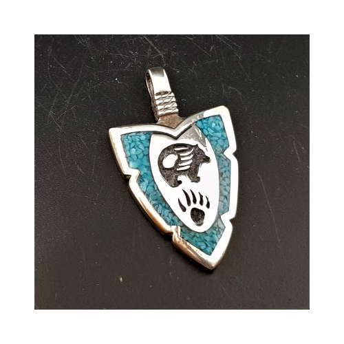 native american made silver arrowhead shaped pendant with turquoise chips and bear and bear paw design