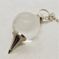 quartz sphere and metal point pendulum close up