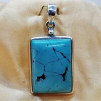 rectangular turquoise pendant set in silver
