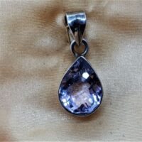teardrop facetted amethyst set in silver close up