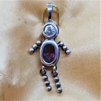 mini silver man set with facetted and clear stone