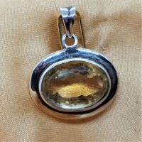 oval faceted citrine in heavy silver setting close up