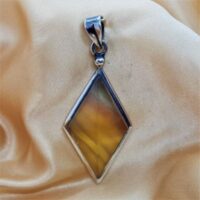 diamond shaped yellow fluorite in silver pendant