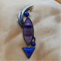 three stone garnet in silver articulated pendant
