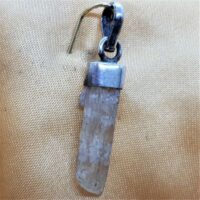 natural hidenite in silver pendant